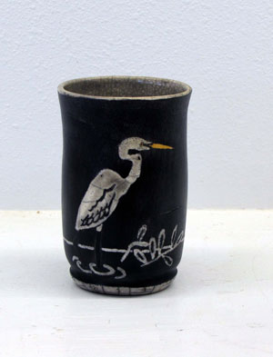 Pottery Artwork by Madeleine Baker currently showing at The Water's Edge Studio and Gallery, Artwork is titled 'Egret', Raku, about 6 inches high; Contact thewatersedge at houston dot rr dot com for more information