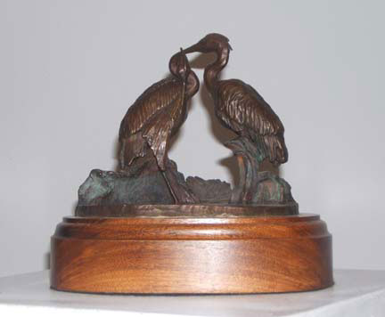 Sculpture Artwork by Pat Moberley Moore currently showing at The Water's Edge Studio and Gallery, Artwork is a bronze sculpture titled 'Blue Herons', 7 inches high; Contact thewatersedge at houston dot rr dot com for more information