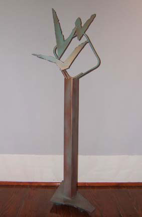 Sculpture Artwork by Pat Moberley Moore currently showing at The Water's Edge Studio and Gallery, Artwork is a steel sculpture with acrylic paint titled 'Night Flight', 39 inches high; Contact thewatersedge at houston dot rr dot com for more information