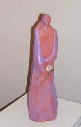 Sculpture Artwork by Pat Moberley Moore currently showing at The Water's Edge Studio and Gallery, Artwork is a terracotta sculpture titled 'Lily',15 inches high; Contact thewatersedge at houston dot rr dot com for more information